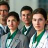 Staff members with badges and uniforms