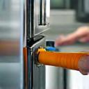 Cleaning specialist scrubbing kitchen appliances